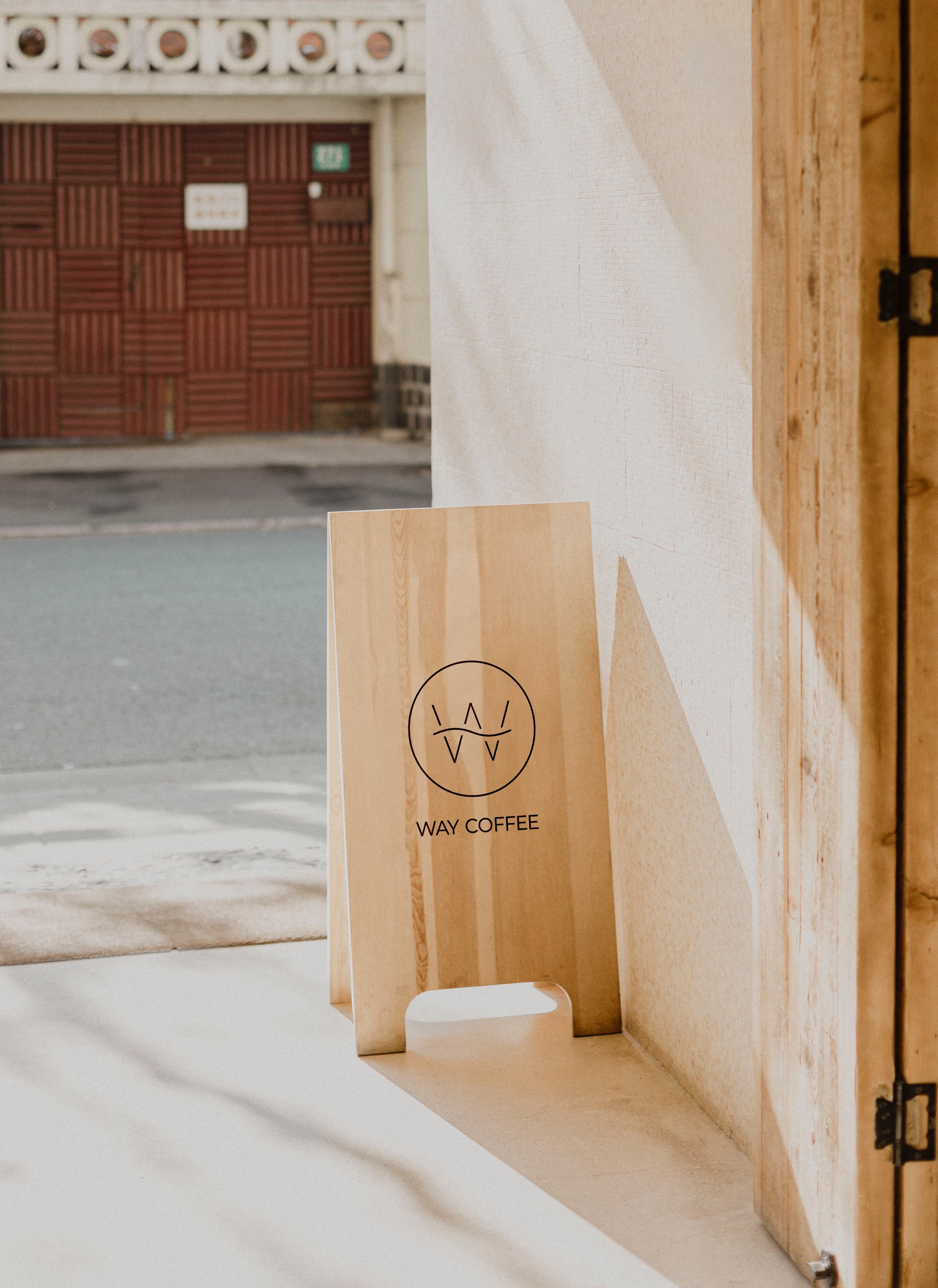 Way Coffee logo presented on an a-frame mockup.